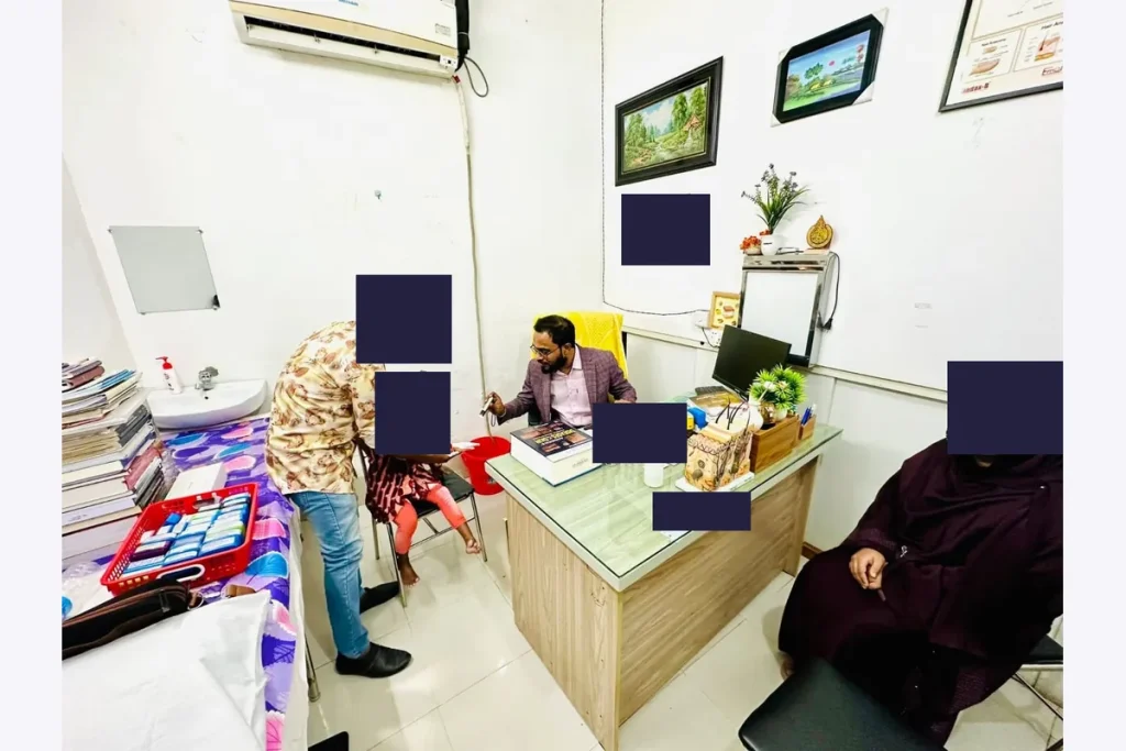 Dr. Shaikh Salman Salam consulting with a child and accompanying adults.