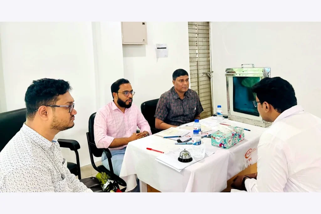 Doctors and staff in a professional meeting around a table